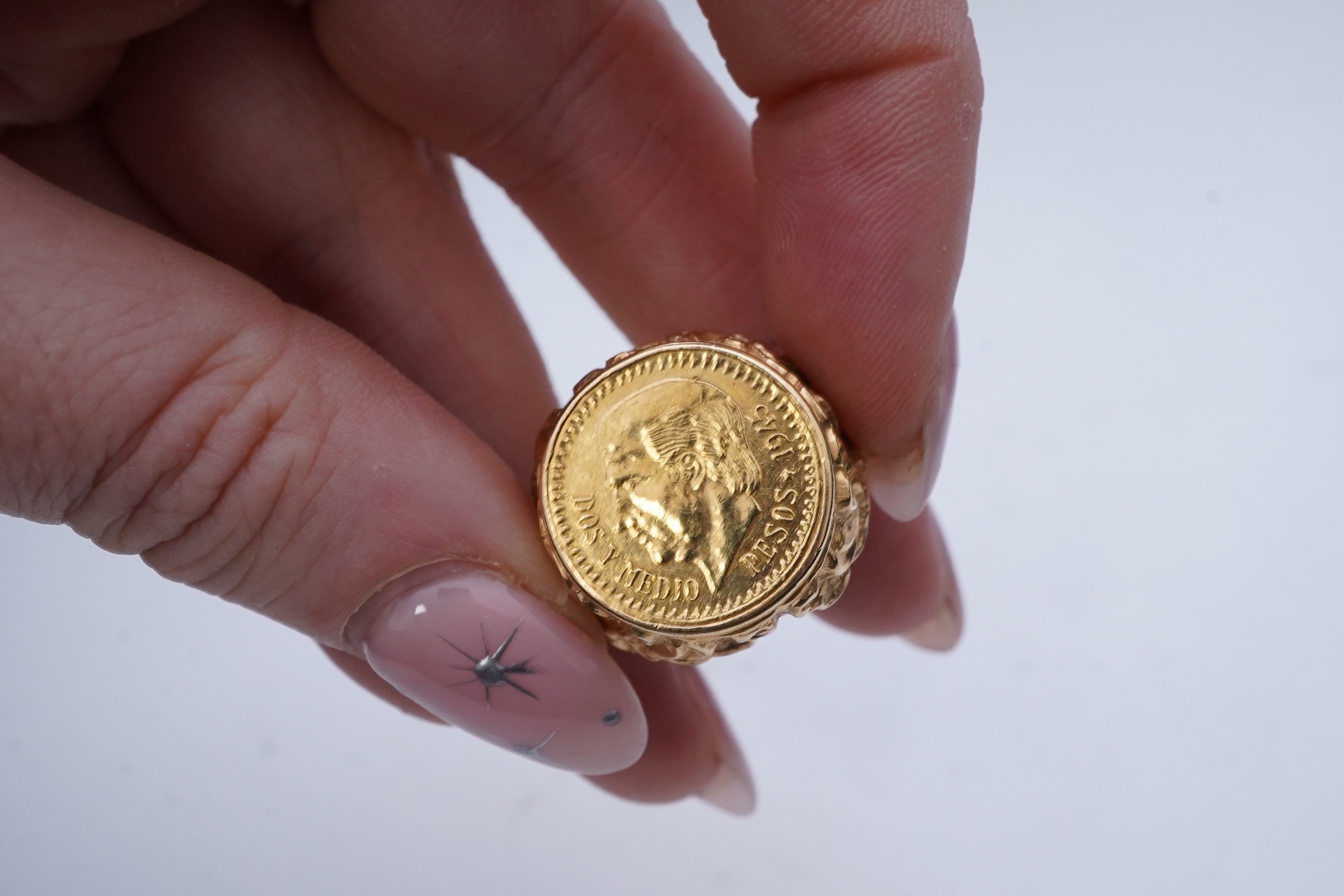 A gold peso coin ring